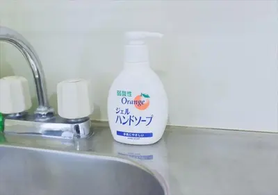 a bottle of cleaner sitting next to a sink at Hirojo Building 203,303,403,603,703 - Vacation STAY 15419 in Tokyo