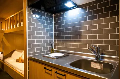 a kitchen with a sink in a room at THE BONDS HOTEL TOKYO in Tokyo
