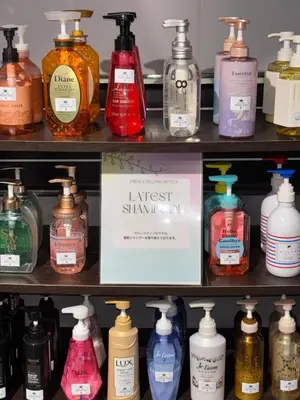 a store shelf filled with lots of bottles of detergents at Hotel PRINCESS2 -\u5927\u4eba\u5c02\u7528- in Tokyo