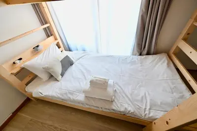 a bunk bed in a room with a window at Tatekawa 333 Residence - \u7acb\u5ddd\u4e09\u4e09\u4f4f\u5b85- crib free in Tokyo