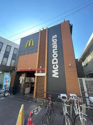 a mcdonalds building with bikes parked outside of it at The Masters Stay SETAGAYA KYODO in Tokyo