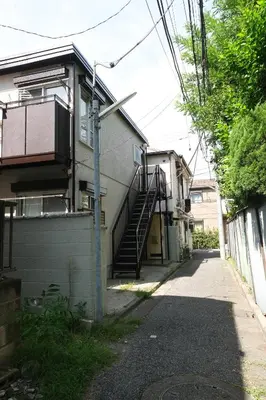 a building with a stairway and a house at Housegreen201 in Tokyo