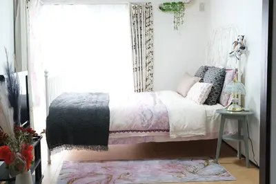 a bedroom with a bed and a window at Housegreen201 in Tokyo