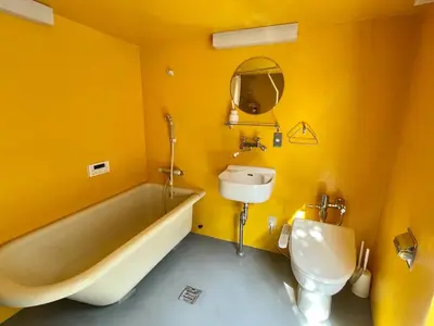 a bathroom with a tub and a sink and a toilet at 1 stop to Shinjuku! Central NAKANO! up to 3ppl.cozy bright room. in Tokyo