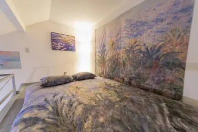 a bedroom with a large bed with pillows on it at Claude Monet Tokyo Shibuya Shinjyuku Wifi Free! in Tokyo