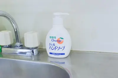 a bottle of cleaning detergent sitting next to a sink at Hirojo Building 203,303,403,603,703 - Vacation STAY 15452 in Tokyo