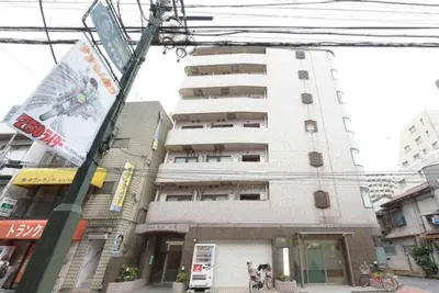 a tall white building with a dog in front of it at Hirojo Building 203,303,403,603,703 - Vacation STAY 15451 in Tokyo