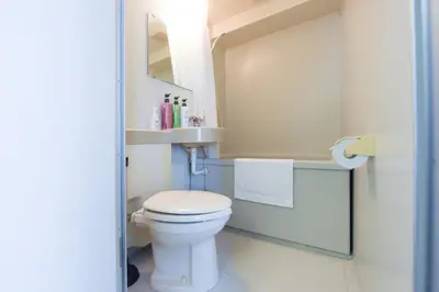 a bathroom with a white toilet and a sink at Hirojo Building 203,303,403,603,703 - Vacation STAY 15453 in Tokyo