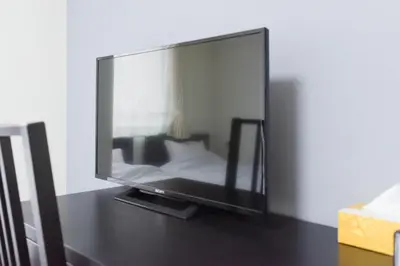 a flat screen tv sitting on top of a table at Hirojo Building 203,303,403,603,703 - Vacation STAY 15453 in Tokyo