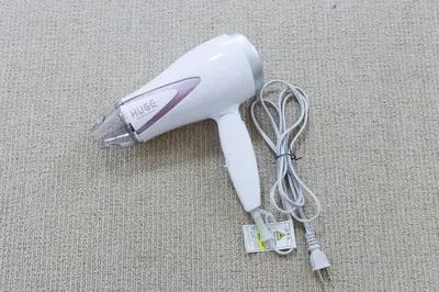 a white blow dryer with a cord on the floor at Hirojo Building 203,303,403,603,703 - Vacation STAY 15453 in Tokyo
