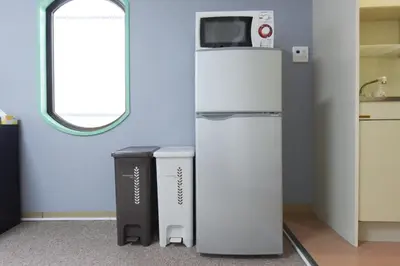 a refrigerator with a microwave on top of it at Hirojo Building 203,303,403,603,703 - Vacation STAY 15453 in Tokyo
