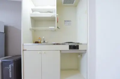 a small kitchen with a sink in a room at Hirojo Building 203,303,403,603,703 - Vacation STAY 15454 in Tokyo