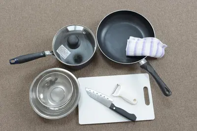 a frying pan with a knife and a cutting board at Hirojo Building 203,303,403,603,703 - Vacation STAY 15454 in Tokyo