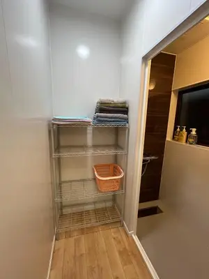 a walk in closet with shelves and a television at Stay Dream Hotel - Vacation STAY 75122v in Tokyo