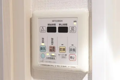 a white electrical outlet on the side of a refrigerator at SLEEPLAB THE STAY \u6e0b\u8c37 -\u7761\u7720\u7279\u5316\u578bHotel- in Tokyo