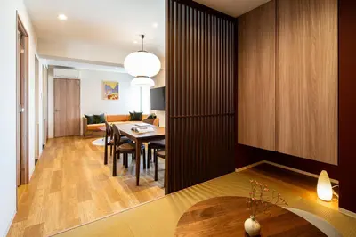 a dining room and living room with a table and chairs at Section L Ueno-Hirokoji in Tokyo