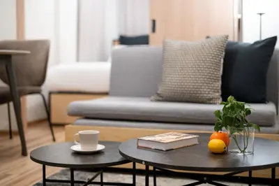 a living room with a couch and a coffee table at \u30a6\u30a7\u30eb\u30b9\u30af\u30a8\u30a2\u30a4\u30ba\u30e0\u5927\u585a in Tokyo