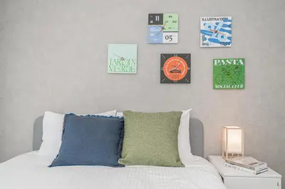a bedroom with a bed and some signs on the wall at ZAITO Tokyo Skytree Yokokawa III \u9326\u7cf8\u753a\u99c5\u304b\u3089\u5f92\u6b69\uff19\u5206 in Tokyo
