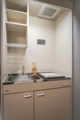 a kitchen with a sink and a stove at \u6bbf\u5802 in Tokyo