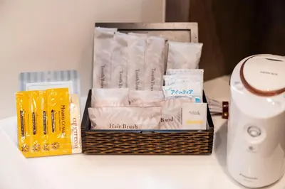 a basket of toiletries sitting on top of a table at HOTEL PASELA LIVING - Vacation STAY 84860v in Tokyo