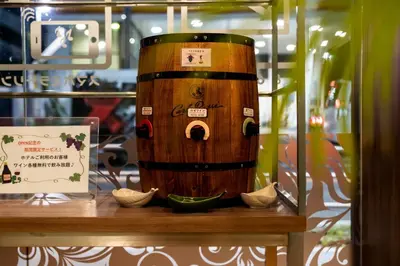 a wooden barrel sitting on a table next to a sign at HOTEL PASELA LIVING - Vacation STAY 84860v in Tokyo