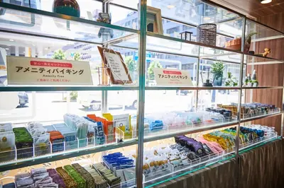 a display case in a store filled with lots of food at HOTEL PASELA LIVING - Vacation STAY 84860v in Tokyo