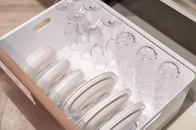 a drawer filled with white plates and wine glasses at HOTEL PASELA LIVING - Vacation STAY 84860v in Tokyo