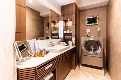 a bathroom with a sink and a washing machine at HOTEL PASELA LIVING - Vacation STAY 84860v in Tokyo