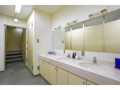 a bathroom with two sinks and two mirrors at Male Only Capsule Inn Hamamatsucho - Vacation STAY 68799v in Tokyo
