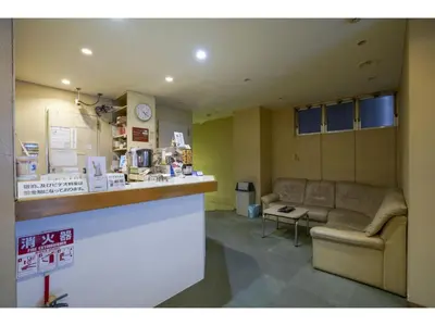 a waiting room with a couch and a counter at Male Only Capsule Inn Hamamatsucho - Vacation STAY 68799v in Tokyo