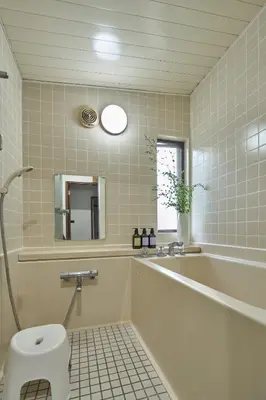 a bathroom with a tub and a toilet and a sink at PDO inn Sangenjaya Art residence in Tokyo