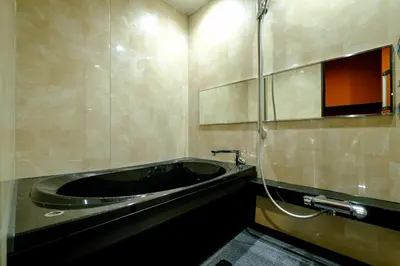 a bathroom with a bath tub and a shower at YANAKA SOW - Cultural Boutique Hotel in Historical area Yanaka - Near Ueno Akiba in Tokyo