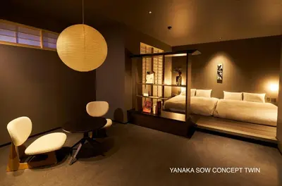 a bedroom with a bed and a table and chairs at YANAKA SOW - Cultural Boutique Hotel in Historical area Yanaka - Near Ueno Akiba in Tokyo