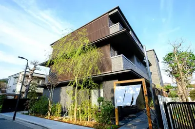 a modern house with a brown roof at YANAKA SOW - Cultural Boutique Hotel in Historical area Yanaka - Near Ueno Akiba in Tokyo