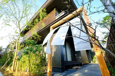 a building with an awning on the side of it at YANAKA SOW - Cultural Boutique Hotel in Historical area Yanaka - Near Ueno Akiba in Tokyo