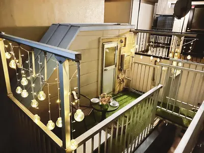 an overhead view of a balcony with a table and a door at Tokyo Louis House in Ueno area close to JR Yamanote Line & Metro Ginza Line walk to Ueno Park and Ameyoko in Tokyo