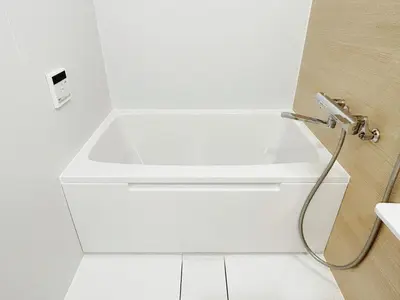a white bath tub in a white bathroom at Tokyo Louis House in Ueno area close to JR Yamanote Line & Metro Ginza Line walk to Ueno Park and Ameyoko in Tokyo