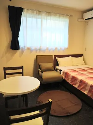 a room with a bed and a chair and a table at Tokyo stay Hut SARI - Vacation STAY 84619v in Tokyo
