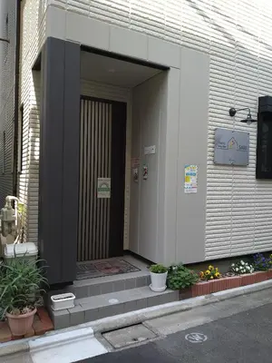 a front door of a building with potted plants at Tokyo stay Hut SARI - Vacation STAY 84619v in Tokyo