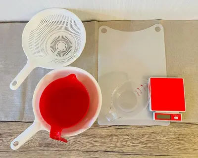 a table with a fan and a bowl of red sauce at Beige in Tokyo