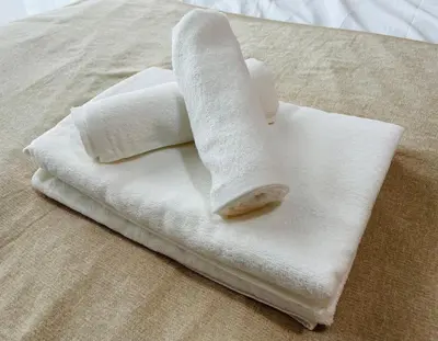 a towel with a banana on top of a bed at Beige in Tokyo