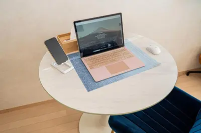 a laptop computer sitting on top of a white table at ZAITO Tokyo Narihira Hotel\u3000\u62bc\u4e0a\u99c5\u304b\u3089\u5f92\u6b69\u516b\u5206\u30db\u30c6\u30eb in Tokyo