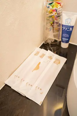 a table with some paper on top of a counter at ZAITO Tokyo Narihira Hotel\u3000\u62bc\u4e0a\u99c5\u304b\u3089\u5f92\u6b69\u516b\u5206\u30db\u30c6\u30eb in Tokyo