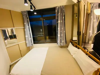 a small room with a bed and a window at Yama house AD0234 in Tokyo
