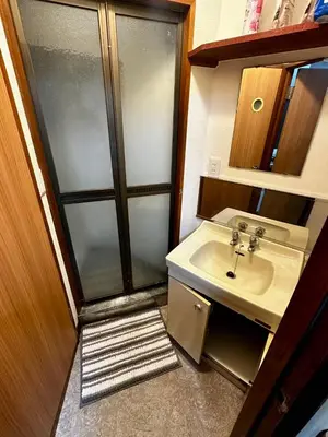 a small bathroom with a sink and a shower at Yama house AD0234 in Tokyo