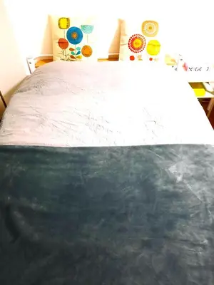 a close up of a bed in a room at Shinjuku Harusame Apartment -Twin room- in Tokyo