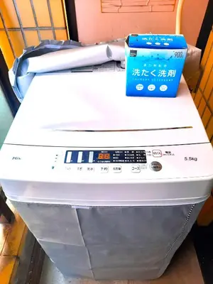 a printer with a blue box on top of it at Shinjuku Harusame Apartment -Twin room- in Tokyo
