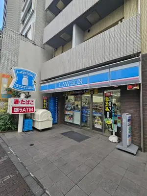 a store front of a building with a pharmacy at Shinjuku Harusame Apartment -Twin room- in Tokyo