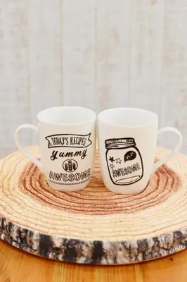two coffee mugs sitting on top of a wooden table at Magical Dream House ★ Maihama - Vacation STAY 12402 in Tokyo