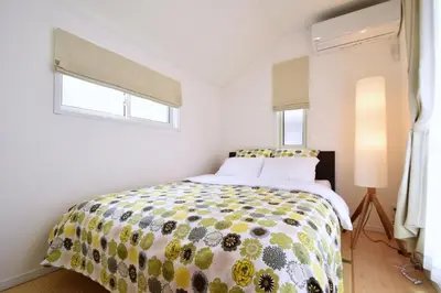 a bedroom with a bed with a colorful comforter at Magical Dream House ★ Maihama - Vacation STAY 12402 in Tokyo